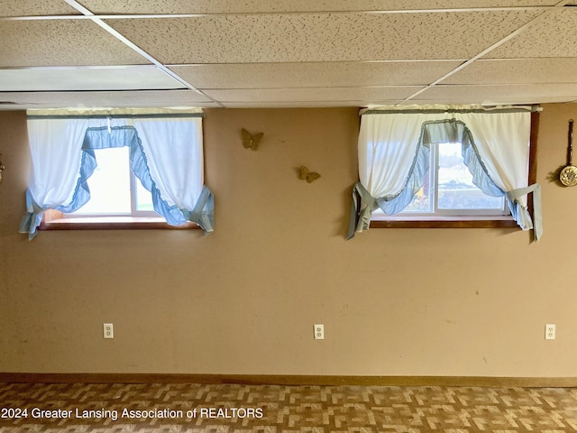 spare room featuring a paneled ceiling