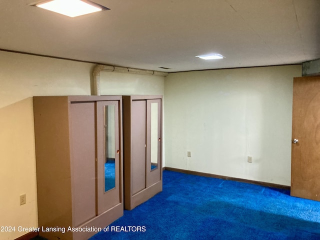 interior space with dark colored carpet