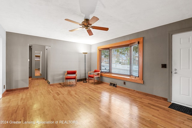 unfurnished room featuring ceiling fan and light wood-type flooring