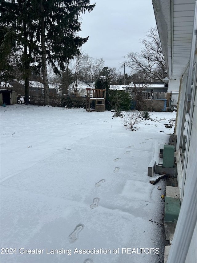 view of yard covered in snow