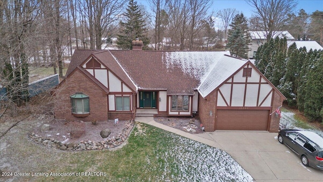 tudor home featuring a garage