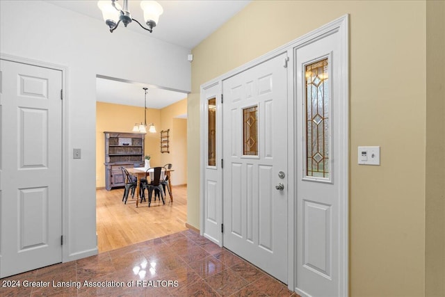 entryway with an inviting chandelier