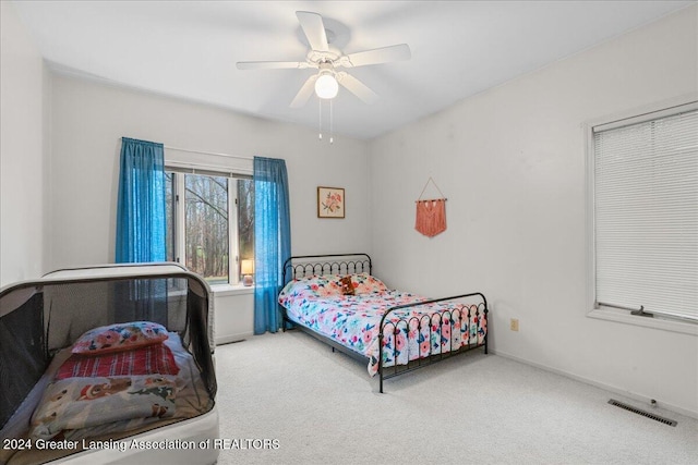 carpeted bedroom featuring ceiling fan