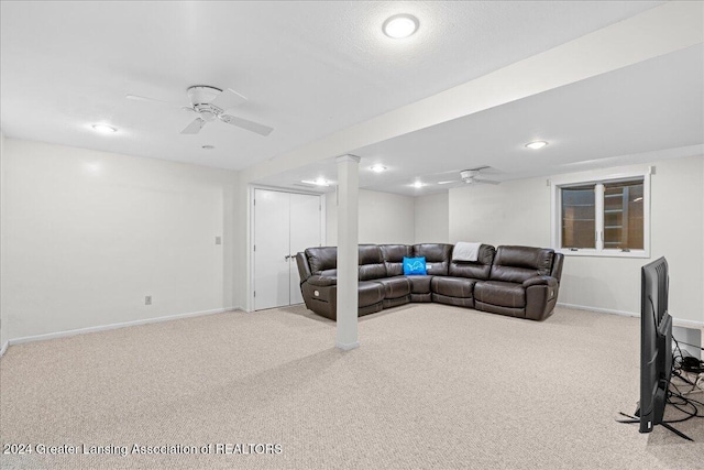 living room featuring ceiling fan and light colored carpet