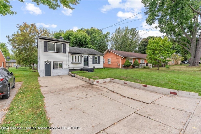 split level home with a front yard