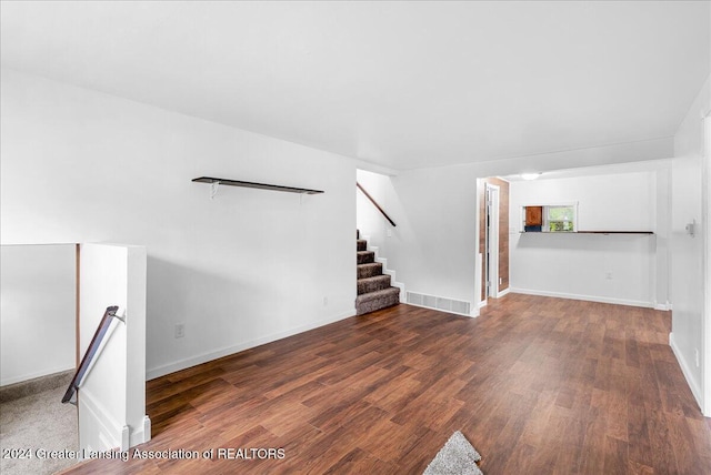 unfurnished living room featuring wood-type flooring