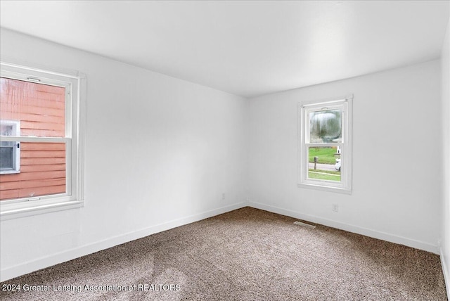 unfurnished room with carpet floors