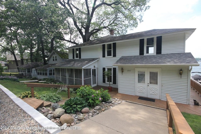 back of house with a deck and a sunroom