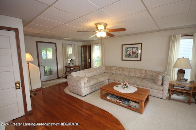 living room featuring a paneled ceiling, ceiling fan, and hardwood / wood-style flooring