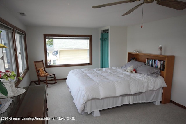 carpeted bedroom with ceiling fan