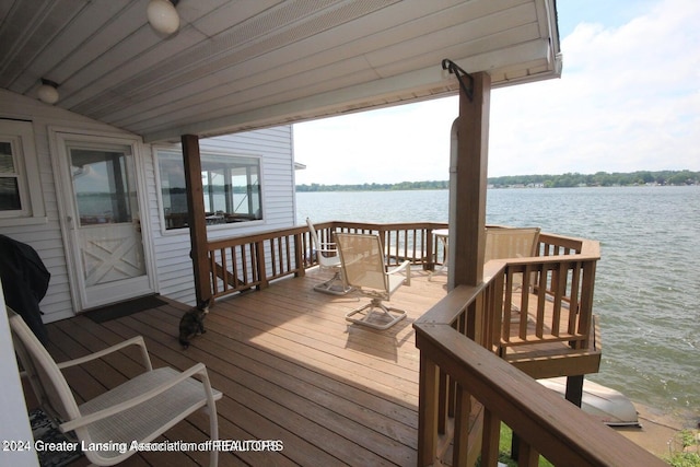 wooden terrace with a water view