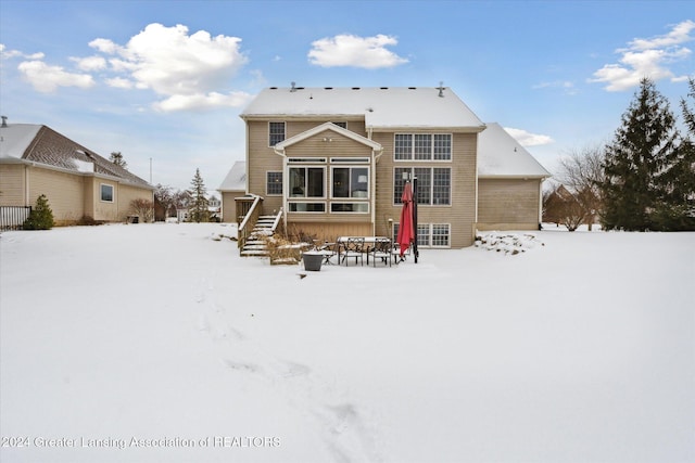 view of snow covered property