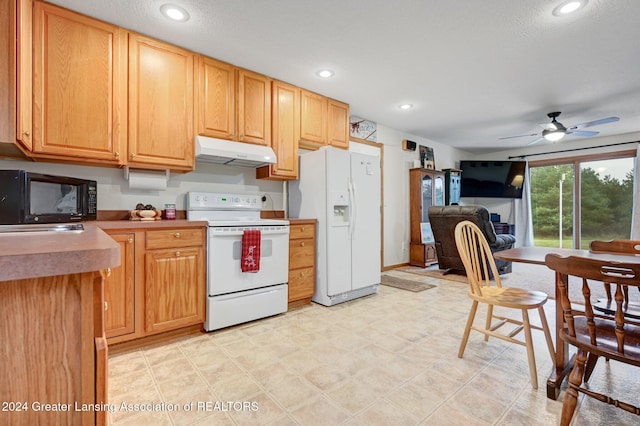 kitchen with ceiling fan and white appliances