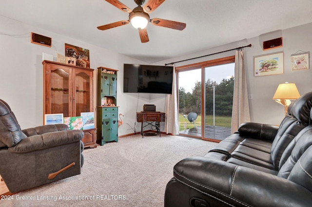 living room featuring carpet flooring and ceiling fan