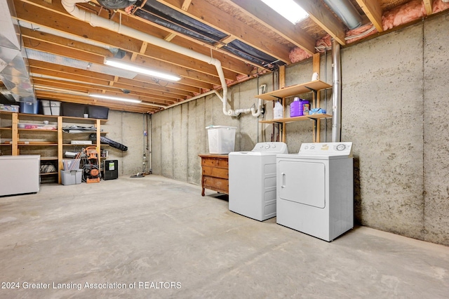 basement with washing machine and clothes dryer