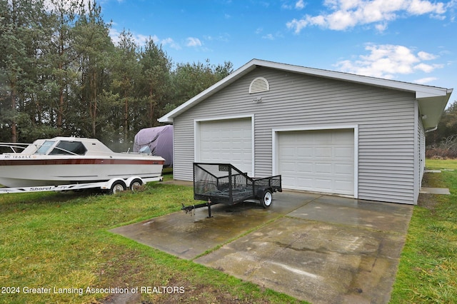 garage featuring a yard