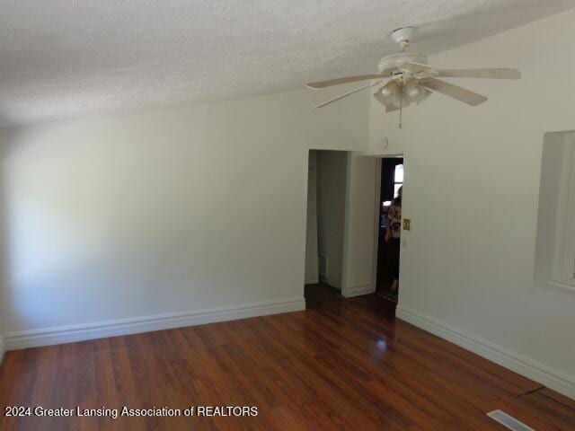 empty room featuring dark hardwood / wood-style floors and ceiling fan