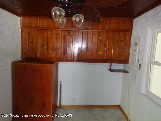 interior space featuring ceiling fan