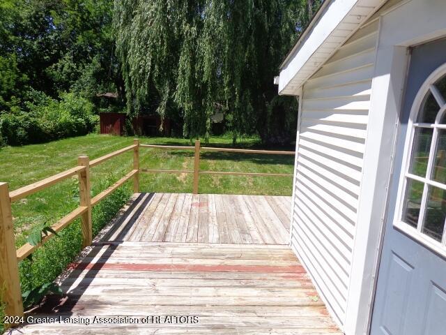 deck featuring a lawn