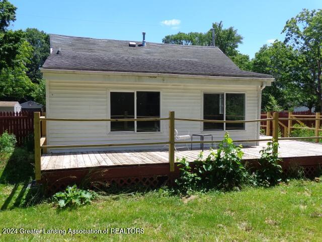 back of house featuring a deck