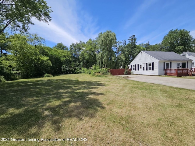 view of yard featuring a wooden deck