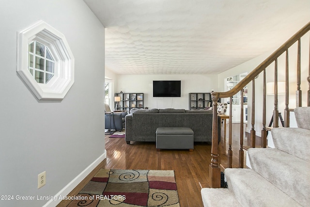 living room with dark hardwood / wood-style floors