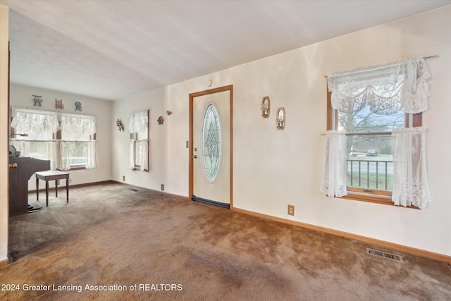 foyer with carpet floors