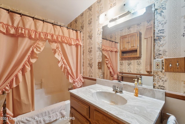 bathroom with vanity and shower / bath combo