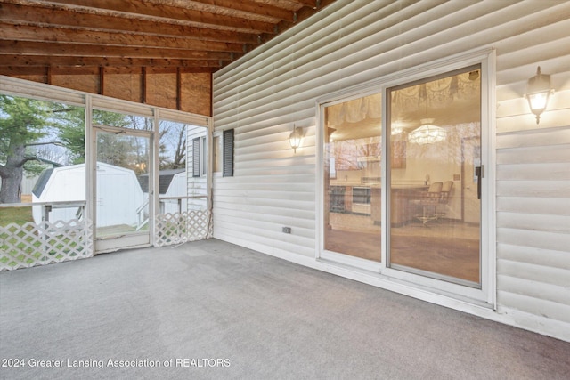 unfurnished sunroom with vaulted ceiling