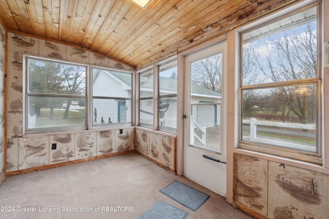 unfurnished sunroom featuring wood ceiling and lofted ceiling