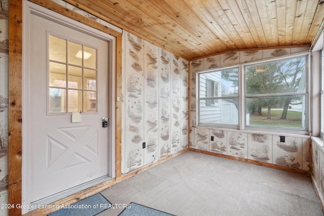 interior space with carpet flooring, wooden ceiling, and vaulted ceiling