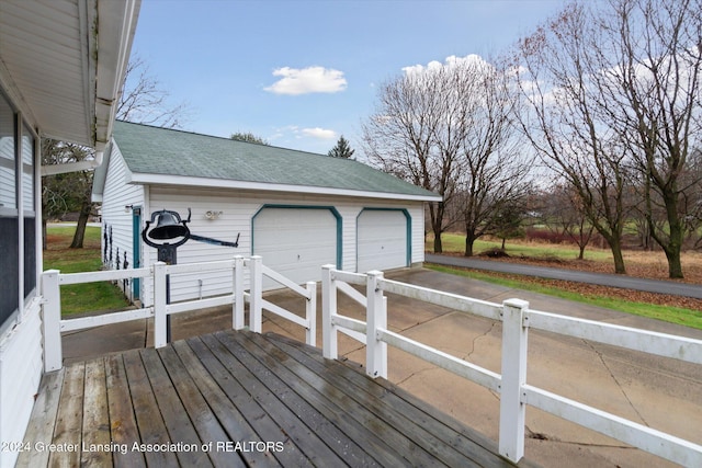 wooden deck featuring an outbuilding