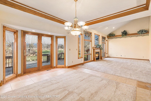 unfurnished room featuring a notable chandelier, light colored carpet, and lofted ceiling