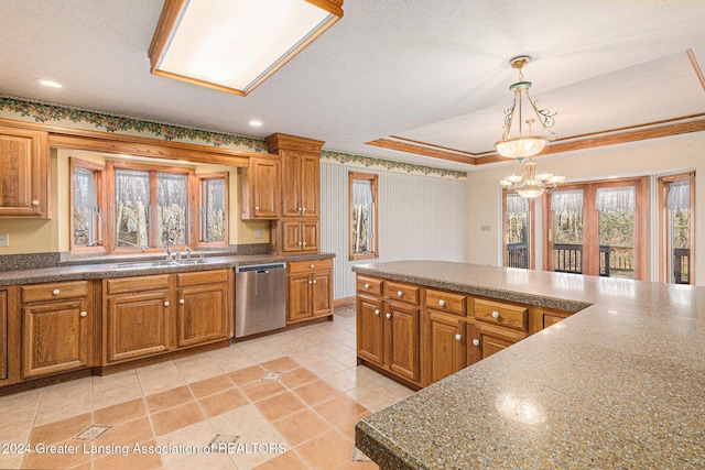 kitchen with dishwasher, sink, an inviting chandelier, pendant lighting, and ornamental molding