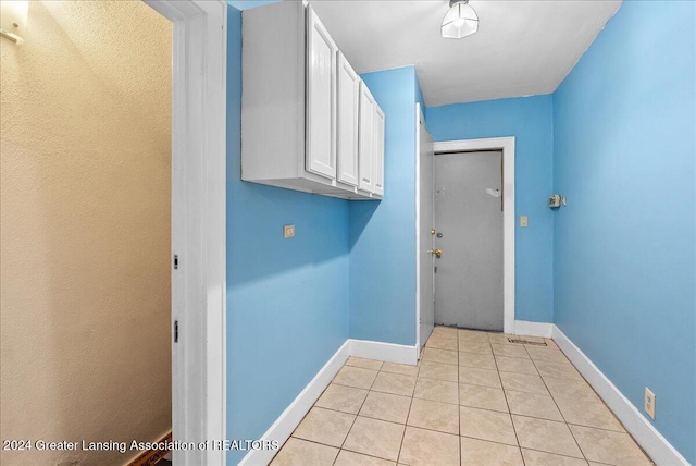 washroom with light tile patterned floors