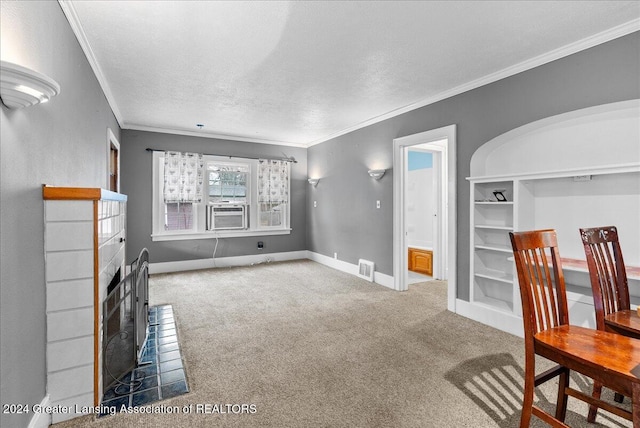 carpeted living room with cooling unit, ornamental molding, and a textured ceiling