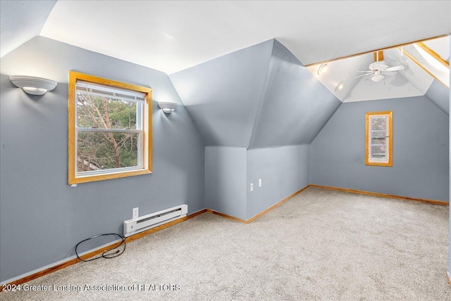 bonus room featuring carpet flooring, a baseboard radiator, ceiling fan, and lofted ceiling