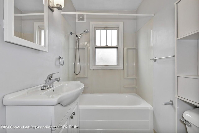 full bathroom with vanity,  shower combination, and toilet