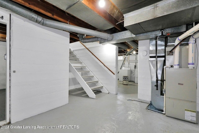 basement featuring washer / clothes dryer and heating unit