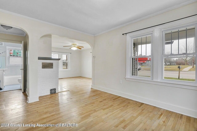 unfurnished living room featuring ceiling fan, plenty of natural light, and light hardwood / wood-style flooring