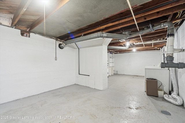 336 S Waverly Rd, Lansing, MI 48917 - unfinished basement featuring washer / dryer