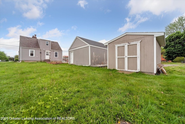 336 S Waverly Rd, Lansing, MI 48917 - back of house with a yard and entry steps