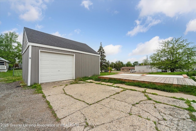 336 S Waverly Rd, Lansing, MI 48917 - detached garage featuring driveway
