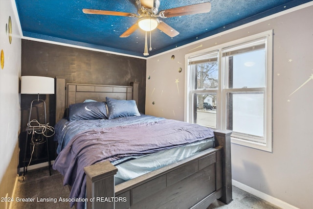 bedroom featuring ceiling fan and carpet flooring