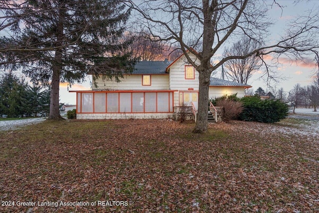 view of property exterior at dusk