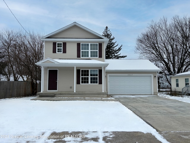 front facade with covered porch and a garage