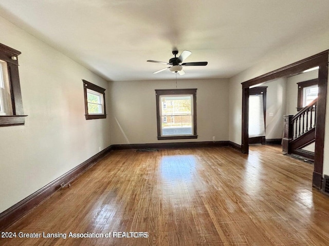 empty room featuring hardwood / wood-style floors, plenty of natural light, and ceiling fan