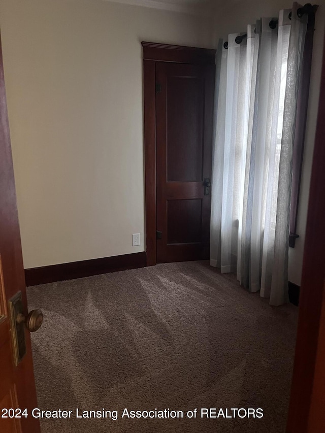 empty room with carpet flooring