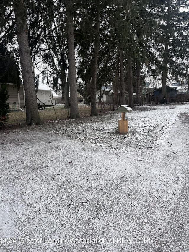 view of yard layered in snow