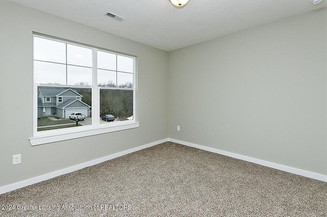 empty room with carpet flooring